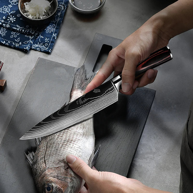 Sharp damascus kitchen knife slicing fish on dark cutting board, precision blade for seafood prep