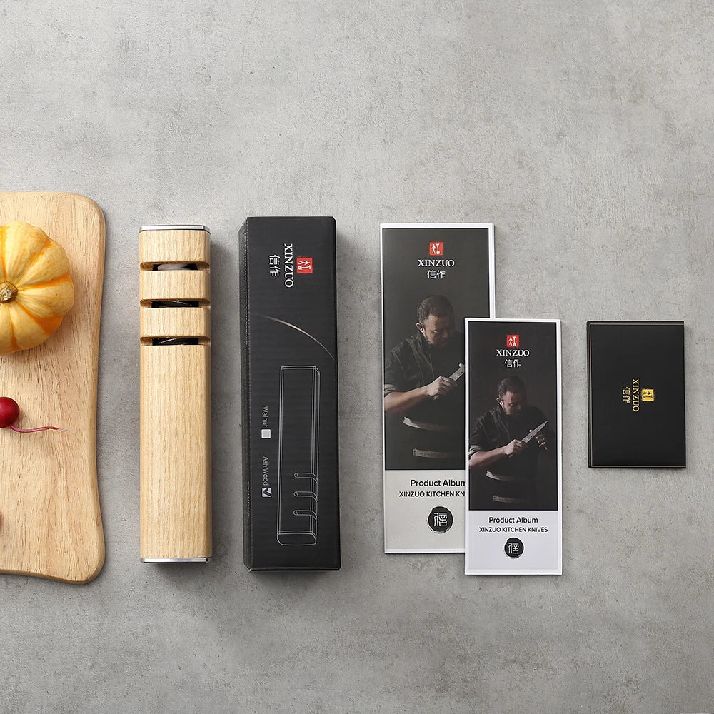 XINZUO wooden knife sharpener with packaging and product albums on concrete surface