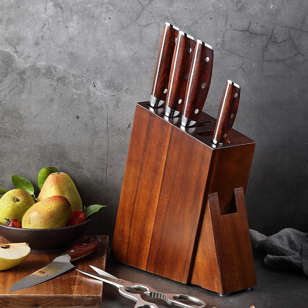 Wooden knife block set with sharp kitchen knives, pear bowl, and scissors on countertop