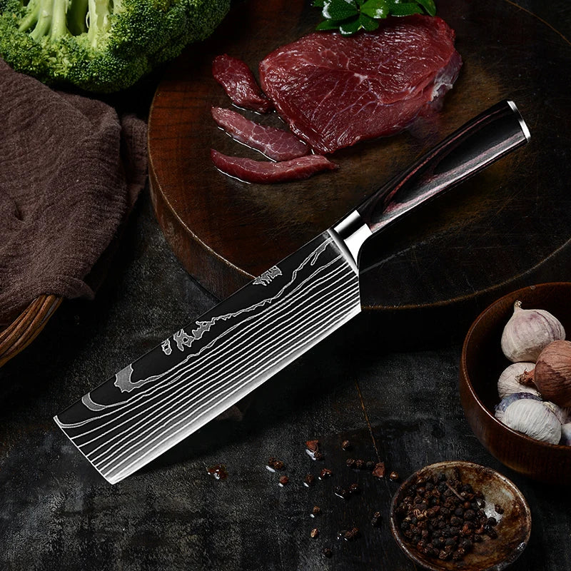 Precision kitchen knife with Damascus steel blade, resting beside raw steak, broccoli, and garlic on dark surface.