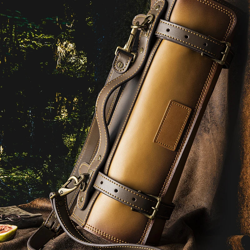 Luxury leather knife roll with brass buckles, ideal for storing precision kitchen knives securely.